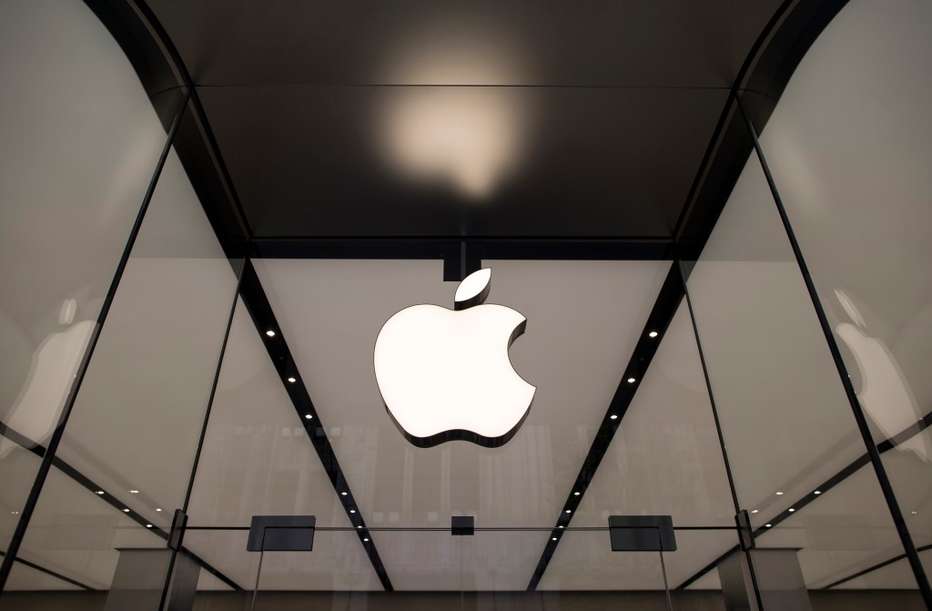 gettyimages-942074990 The Apple logo hangs above the entrance to the Apple Shinjuku store